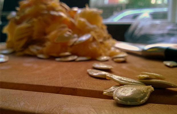 Cutting Board with Pumpkin Meats and Seeds