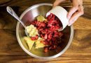 Mix strawberries into cannabutter | Jessica Catalano + Cannabis Now Magazine